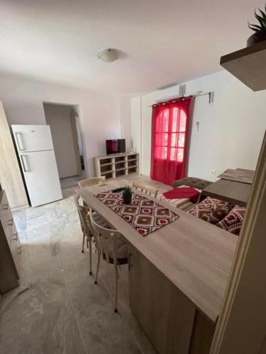 a kitchen and dining room with a table and chairs at Panorama Hotel in Kalymnos