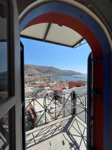 a view of a city from a window at Panorama Hotel in Kalymnos