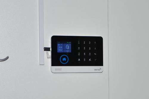 a cell phone is attached to a door at Emina Hiška in Braslovče
