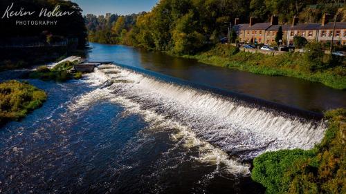 an aerial view of a river with waterfalls at 3 bed house in Lucan