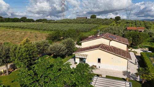 an aerial view of a building in a vineyard at Hotel Poggio Bertino in Montemerano