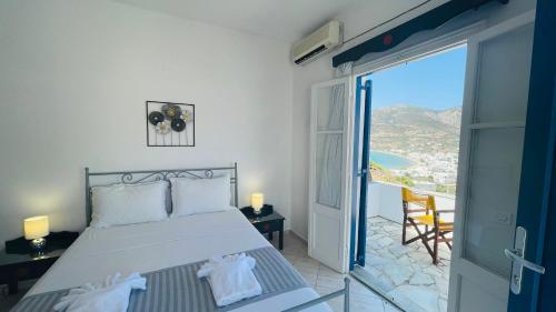 Postel nebo postele na pokoji v ubytování Venikouas Hotel