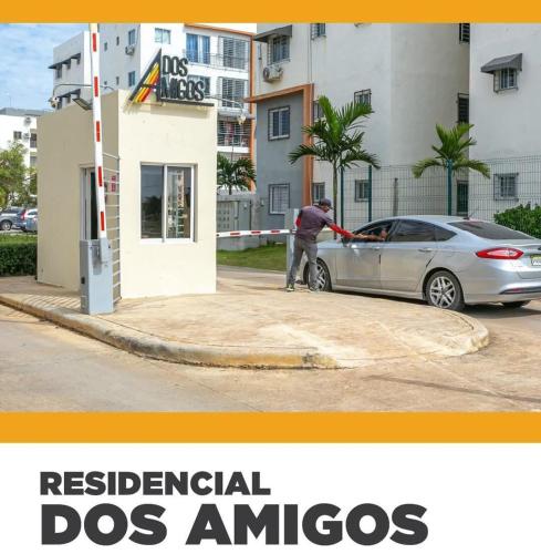 a man is fueling a car at a gas station at Comfort, safety and close to everything in Los Paredones