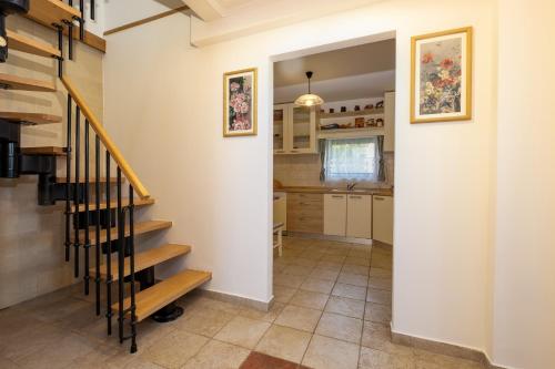 a hallway with a staircase in a house at Monte Petrus in Vujci