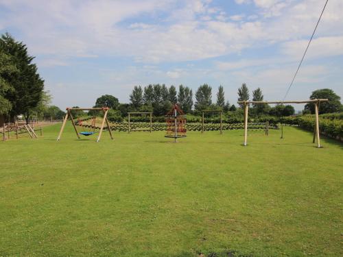 an empty park with a bunch of playground equipment at Dove in Leominster
