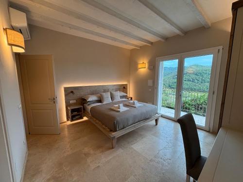 A bed or beds in a room at Relais dei Molini - Villa dei Molini