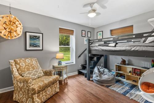 a room with a couch chair and a bunk bed at Updated and Spacious Home with Huge Yard Office and Decks in Brentwood