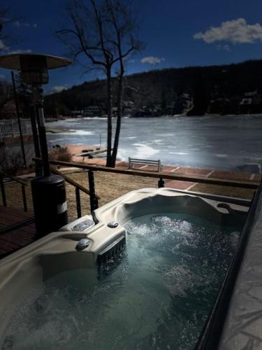 a jacuzziificialificialificialificialificialificialificialificialificialificialificial at Lakefront home with kayaks fire pit hot tub and walk to restaurants and bars in Lake Harmony