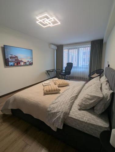 Postel nebo postele na pokoji v ubytování Central stylish apartment