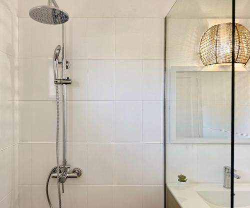 a white bathroom with a shower and a sink at Canaryislandshost l Olympica in Teguise