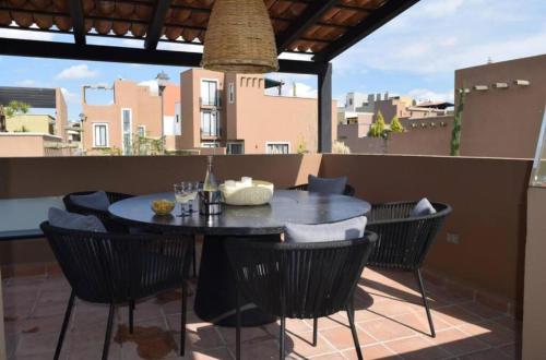 a table and chairs sitting on a patio at Style and luxury The best refuge in San Miguel in San Miguel de Allende