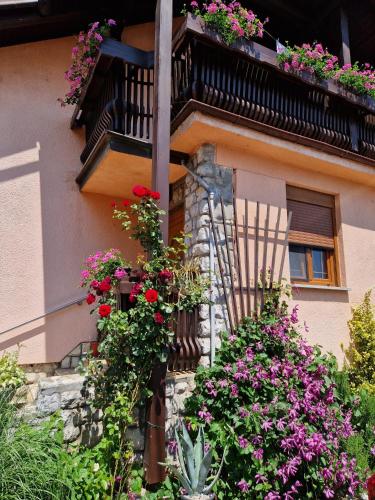 a building with flower boxes and a balcony at Studio apartman Marica - Ogulin, Hrvatska in Ogulin
