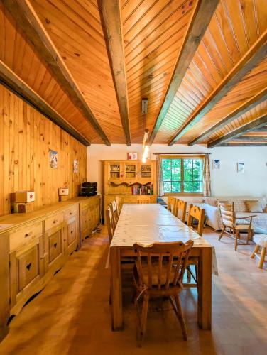 a large dining room with a table and chairs at Grand chalet familial en pleine nature à Torgon in Torgon