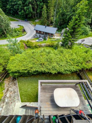 an aerial view of a house with a wooden deck at Grand chalet familial en pleine nature à Torgon in Torgon