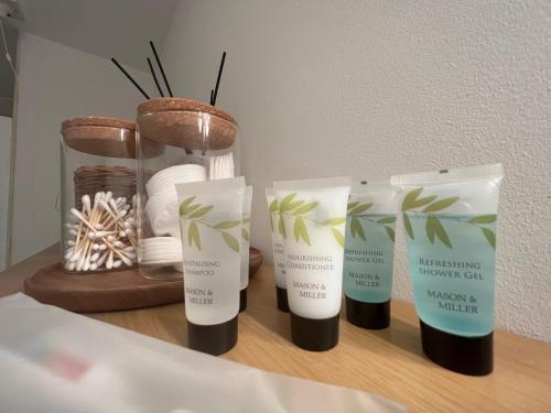 a group of three products sitting on a table at Cosy apartment in town centre in Finedon