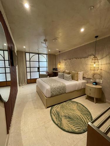 a large bedroom with a large bed and a table at Hotel Rio Guayas by Art Hotels in Guayaquil