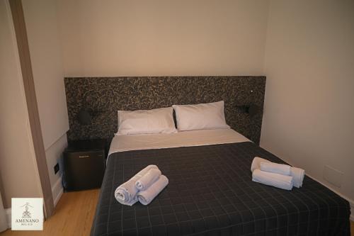 Postel nebo postele na pokoji v ubytování Amenano Relais Rooms