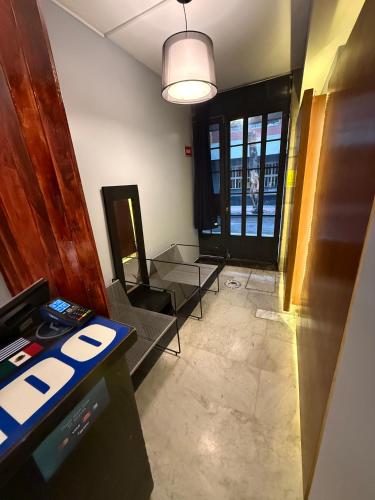 an empty office with a desk and a table at RMS Suites - Zona Rosa in Mexico City