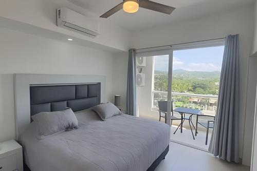 Ένα ή περισσότερα κρεβάτια σε δωμάτιο στο Costa Paraíso D-23 1-Recamara