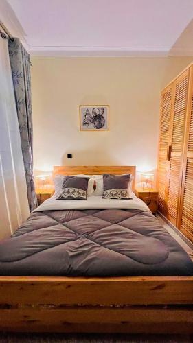Кровать или кровати в номере Kalitaani Homes