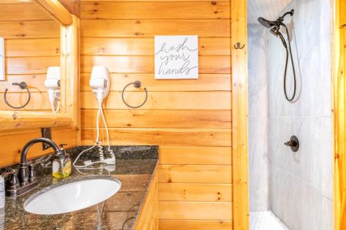 a bathroom with a sink and a shower at Rhythm & Blues By Avada Properties in Gatlinburg