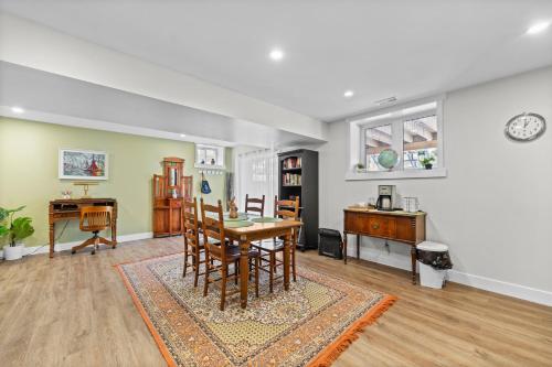 a dining room with a table and a desk at Family-friendly 2br Near Lake & Downtown in Cobourg