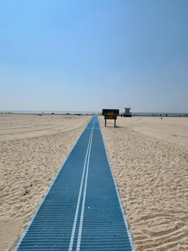 a blue line in the middle of a beach at Family-friendly 2br Near Lake & Downtown in Cobourg