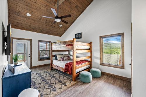 a bedroom with a bed and a ceiling fan at Premier Mountain Views By Avada Properties in Gatlinburg