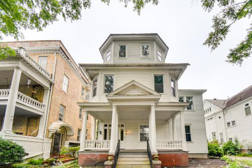 a large white house with columns at Walk to River and Downtown Portsmouth Apartment! in Portsmouth