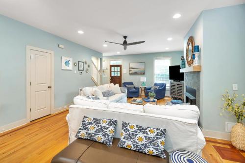 a living room with two white couches at 1104 Demere Road in Saint Simons Island