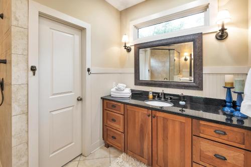 a bathroom with a sink and a mirror at 1104 Demere Road in Saint Simons Island