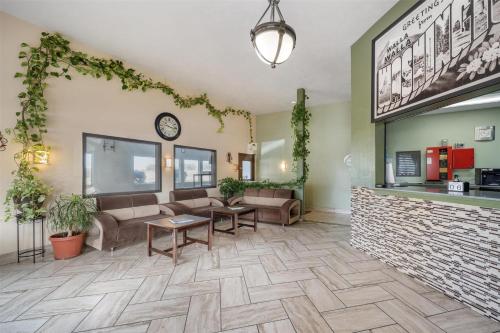 a lobby at a hospital with couches and tables at SureStay by Best Western Walla Walla in Walla Walla