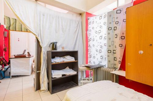 a bedroom with a bed and a wall with numbers on it at Charming Studio in Amaliada, Greece with Private Entrance in Amaliás