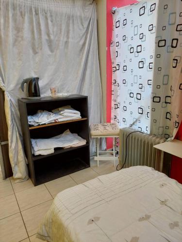 a room with a bed and a wall with a mattress at Charming Studio in Amaliada, Greece with Private Entrance in Amaliás
