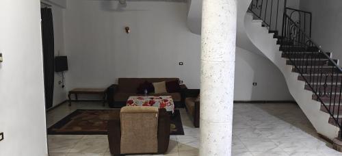 a living room with a couch and a table at THE Nile Diamond Guest House in Luxor