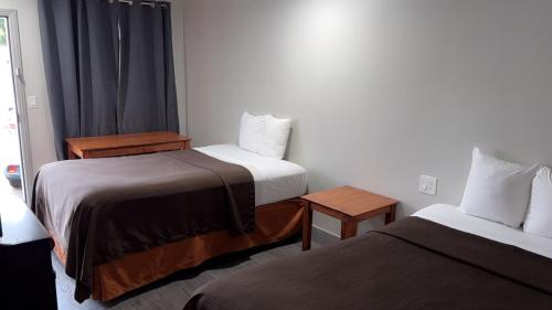 Postel nebo postele na pokoji v ubytování 6 Rivers Motel