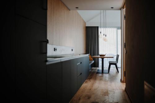 a kitchen with a counter and a table in a room at innea in Ciardes