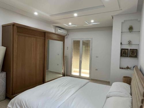 Katil atau katil-katil dalam bilik di Cozy apartment by the cost