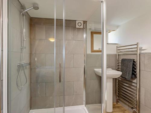a bathroom with a shower and a sink at 3 Bed in Bude CORYM in Morwenstow