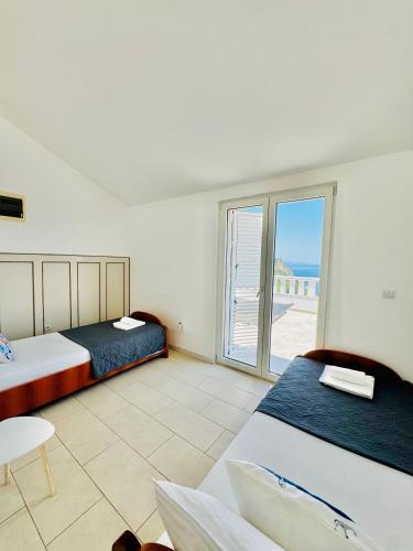 Un ou plusieurs lits dans un hébergement de l'établissement Budva Felix Suites