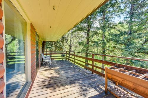 a porch of a house with a bench on it at Dog Friendly Cabin with Yard and Mtn Views in Cascade in Cascade-Chipita Park