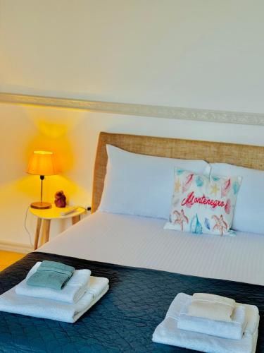 Un ou plusieurs lits dans un hébergement de l'établissement Budva Felix Suites