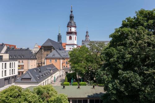 a view of a city with a clock tower at 4-room apartment in the heart of Chemnitz in Chemnitz