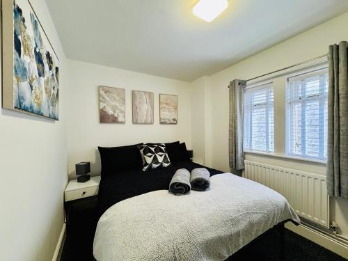 a bedroom with a bed with shoes on it at Twin Farms Apartment, Super location, with parking in Kenton