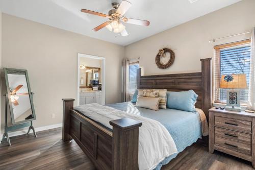 a bedroom with a bed and a ceiling fan at Oak Lane Escape - Branson - Resort Condo on Golf Course with Endless Amenities in Branson West