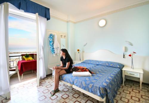 Säng eller sängar i ett rum på Hotel Cadiz