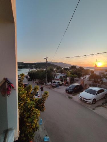 a view of a street with cars parked in a parking lot at Galia Apartment in Ksamil