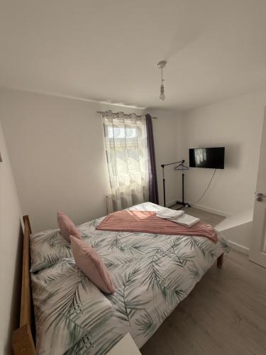 a bedroom with a bed in a room with a window at Sleep In oxford in Oxford