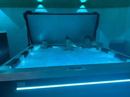 two children in a hot tub with blue lights at Landgasthof und Pension Zum löwen in Bischofsheim an der Rhön