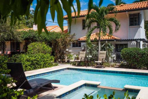 a swimming pool in front of a house at Family 4 Bedroom 3 Bathroom Pool Home with Huge Yard in Bradenton